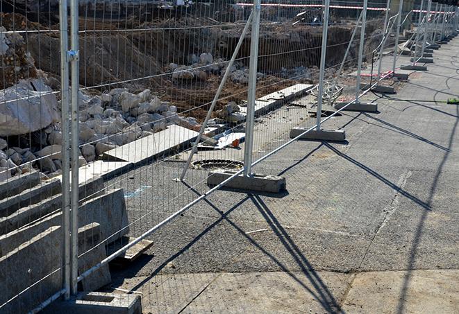 temporary fence panels set up for crowd control at outdoor event